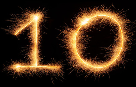 The number 10 using sparklers, against a black background.
